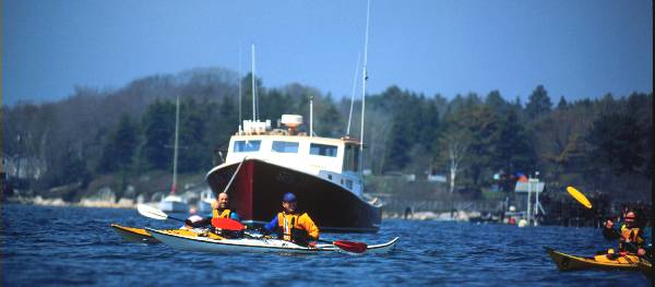 Fishing boats and recreational craft work and play on Casco Bay